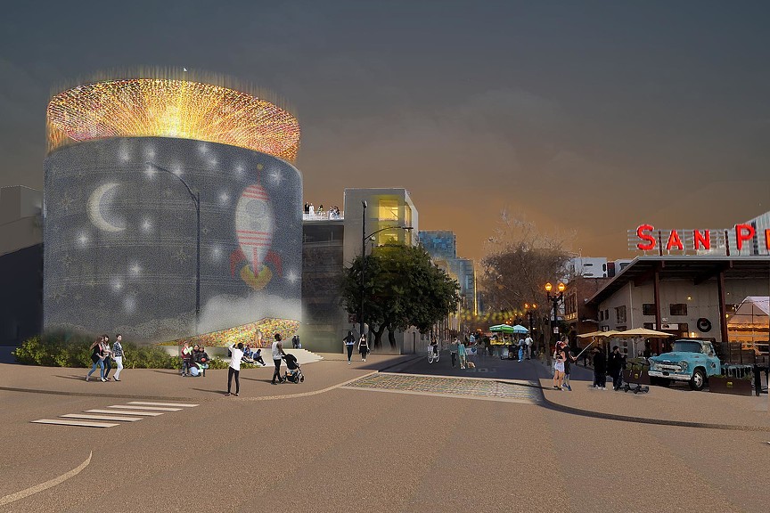 A large circular building with a large circular structure in the middle.